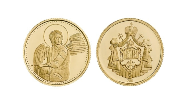 Zlatni kovani dukat sa motivom Belog Anđela s jedne strane i grbom Srpske Pravoslavne Crkve sa druge strane.