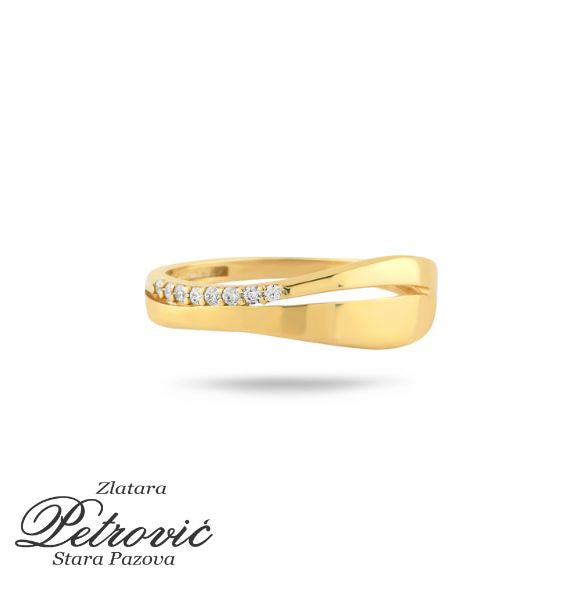 Zlatni prsten sa uvijenim dizajnom i nizom cirkona na gornjoj strani