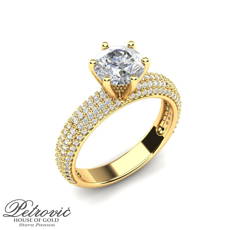 Verenički prsten od žutog zlata raskošnog dizajna sa mini cirkonima okolo prstena i jednim velikim cirkonom na sredini
