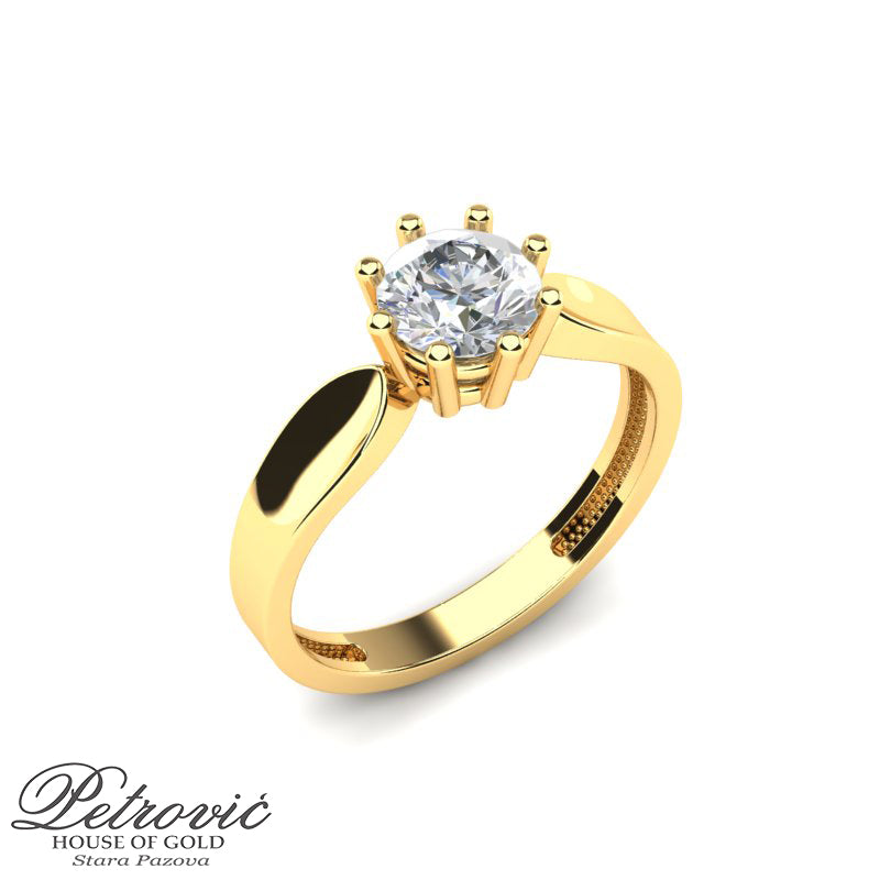 Verenički prsten izrađen od žutog zlata sa centralno postavljenim okruglim cirkonom u osmostrukom držaču, prikazan na beloj pozadini iz dva ugla.