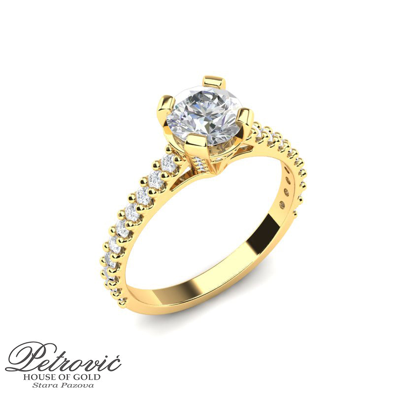 Elegantni verenički prsten od žutog zlata sa cirkonima urezanim u prsteni velikim cirkonom na sredini prstena