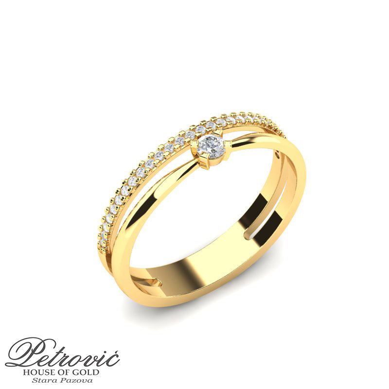 Minimalistički verenički prsten od žutog zlata ukrašen sitetičkim kristalima